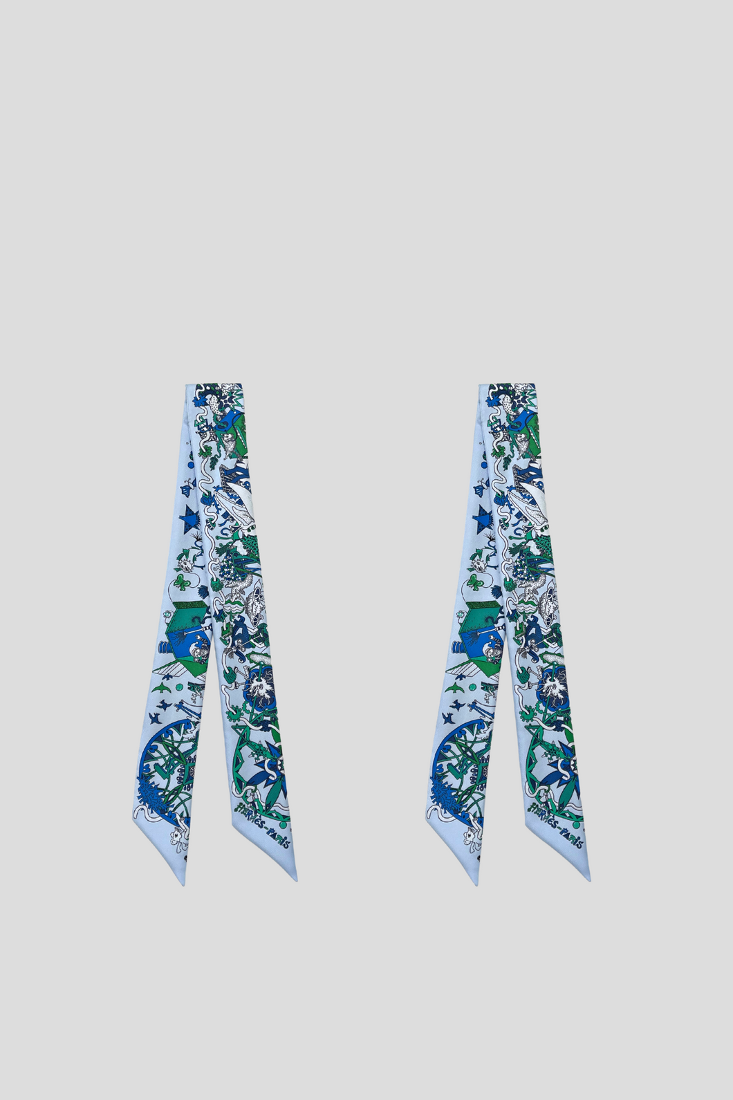 A Pair of Blue La Folle Parade Twillies by Hermès