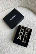 Load image into Gallery viewer, Gold Crystal CHA NEL Logo Earrings by Chanel
